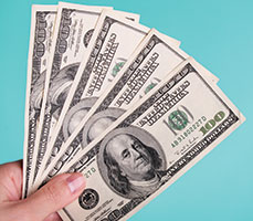 Image of stacks of dollar bills. Link to Gifts of Cash, Check, and Credit Cards.