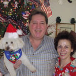Photo of John & Diana Martakis with their dog. Photo of John & Diana Martakis with their dog.